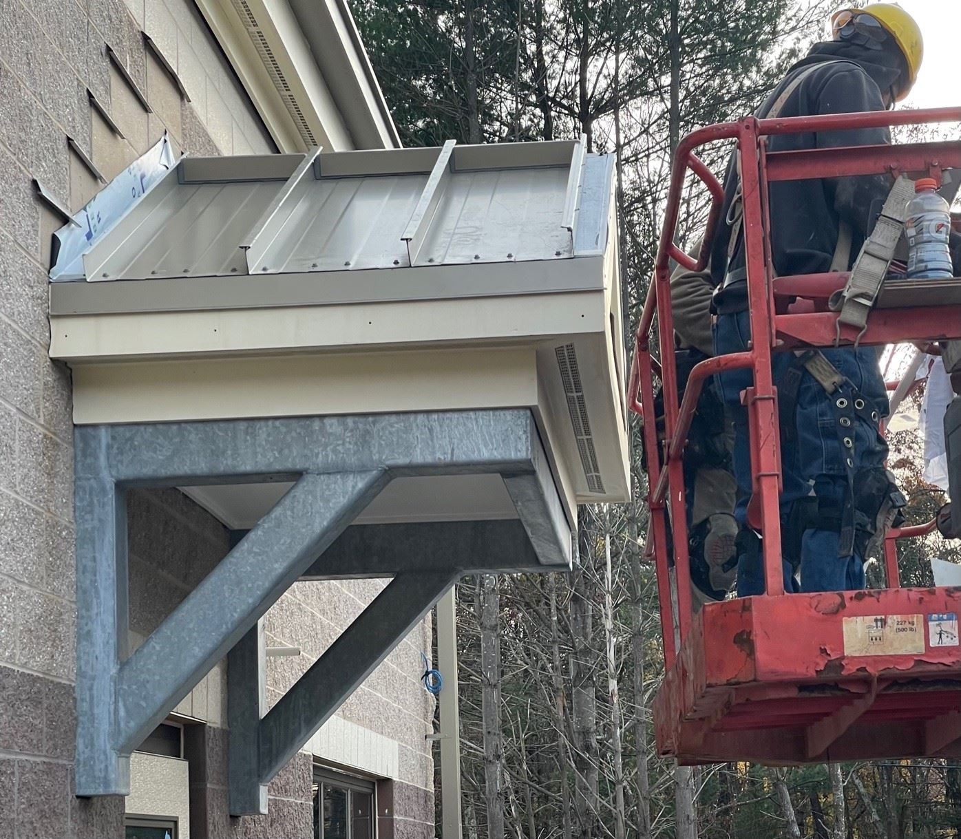 Installation of the Standing Seam Roof Over Entrance Canopy